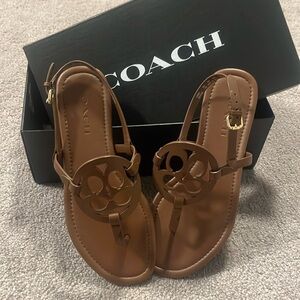 New in box size 7 Coach sandals in tan colour